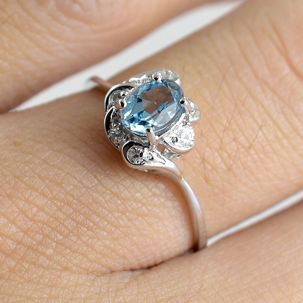 SKJewelryfactory แหวนเงินแท้ 92.5% ฝังพลอยสวิสบลูโทปาซแท้ ประดับเพชร ER01112-SBT