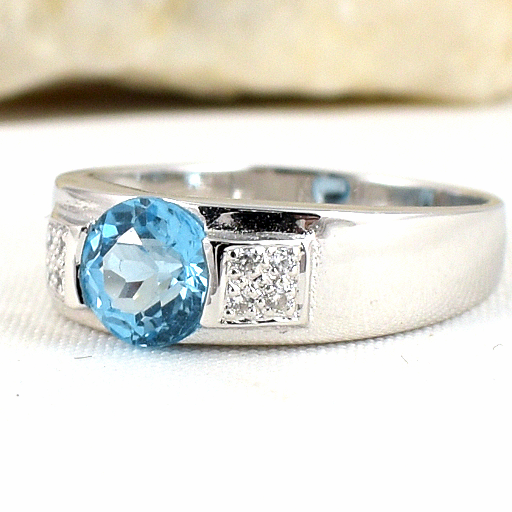 SKJewelryfactory แหวนเงินแท้ 92.5% ฝังพลอยสวิสบลูโทปาซแท้ รูปแบบออกแนวสปอต ER00890-SBT