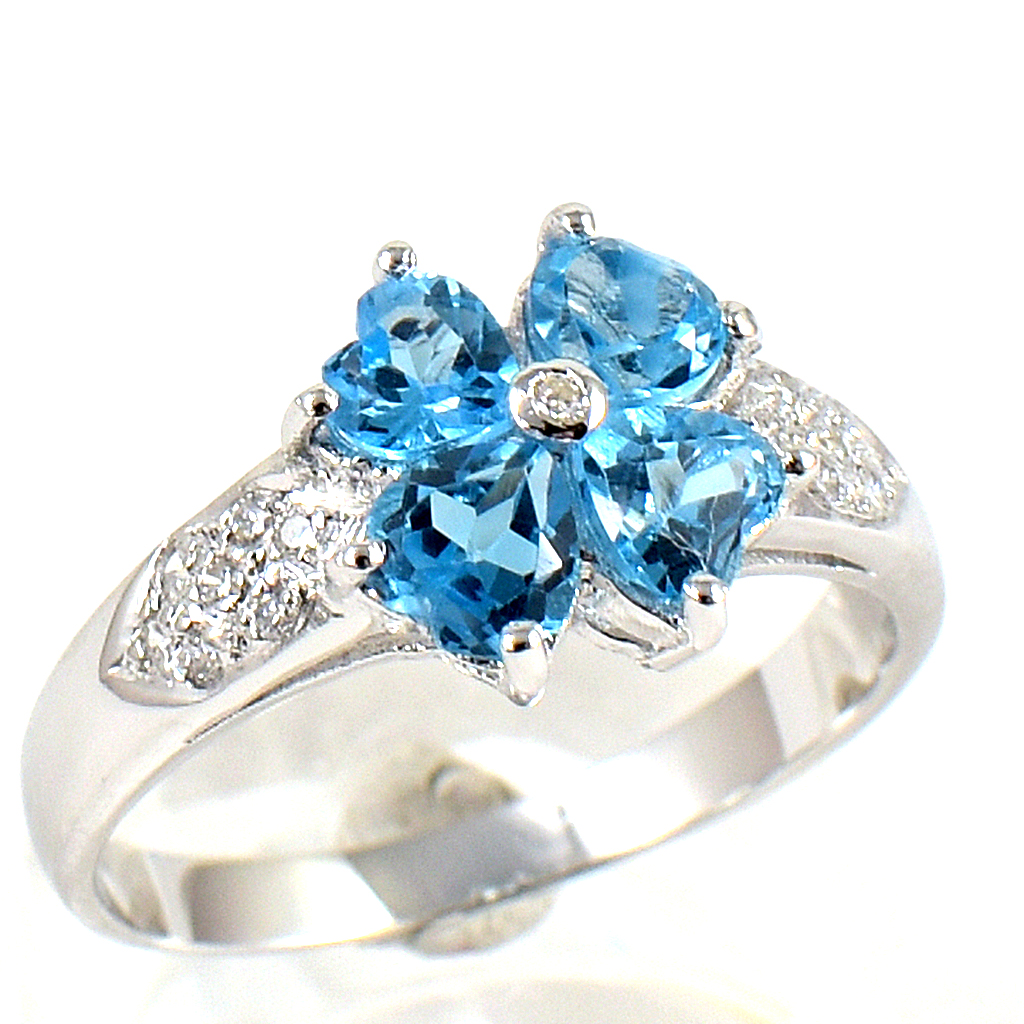 SKJewelryfactory แหวนเงินแท้ ฝังพลอยสวิสบลูโทปาซแท้ ทรงดอกไม้ ER00874-SBT