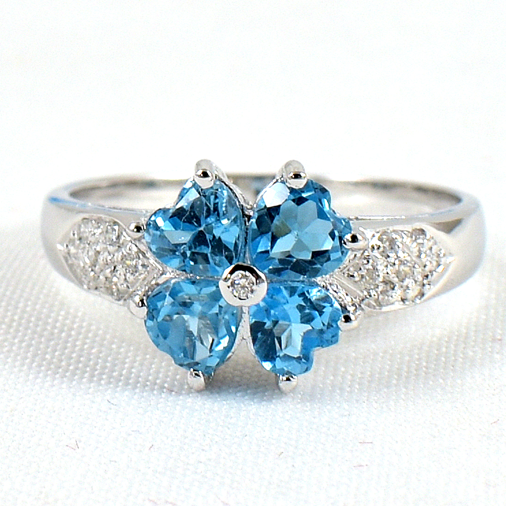 SKJewelryfactory แหวนเงินแท้ ฝังพลอยสวิสบลูโทปาซแท้ ทรงดอกไม้ ER00874-SBT