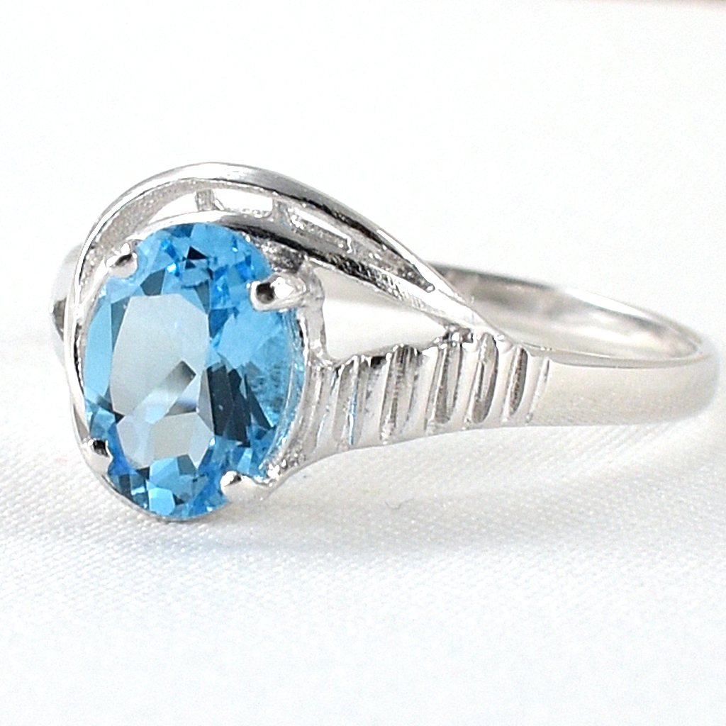 SKJewelryfactory แหวนเม็ดเดี่ยว พลอยสวิสบลูโทปาซแท้ เน้นโชว์ความโดดเด่นของตัวพลอย ER00027-SBT