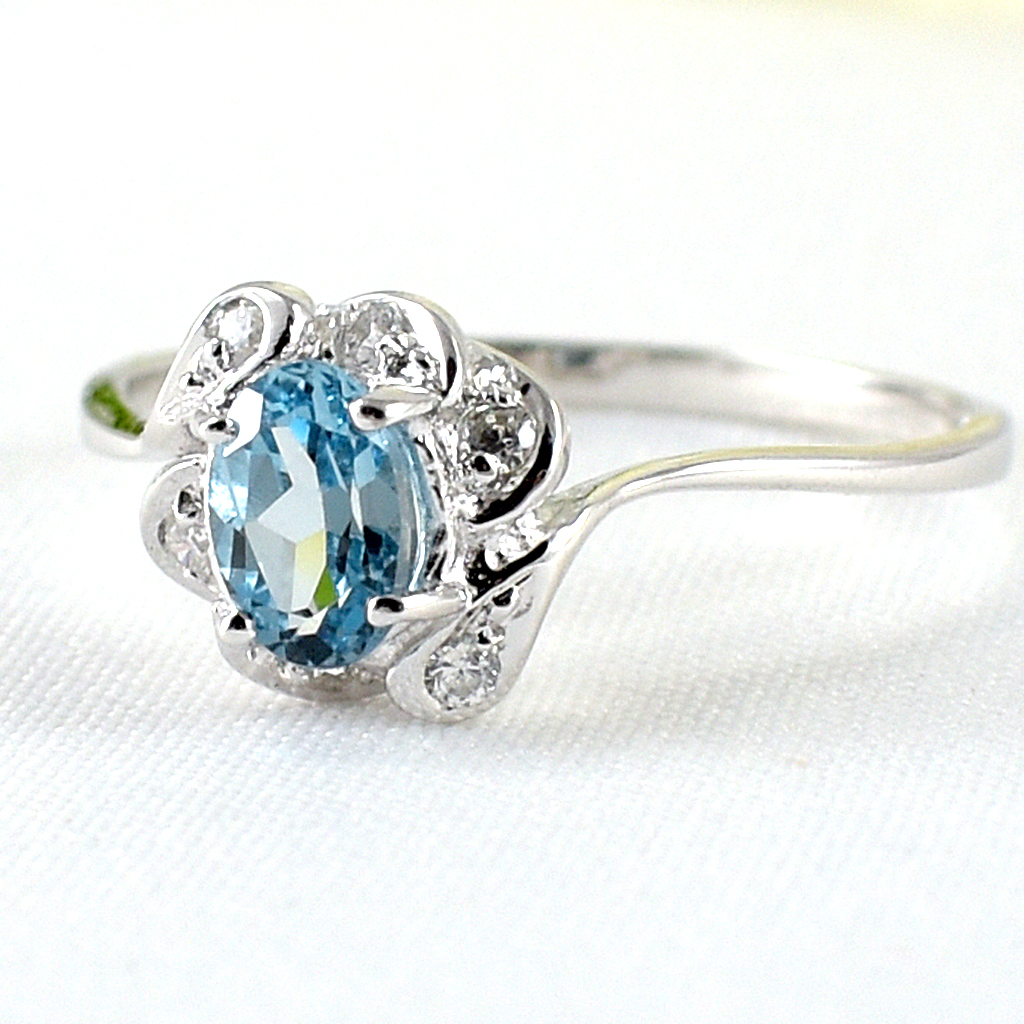 SKJewelryfactory แหวนเงินแท้ 92.5% ฝังพลอยสวิสบลูโทปาซแท้ ประดับเพชร ER01112-SBT