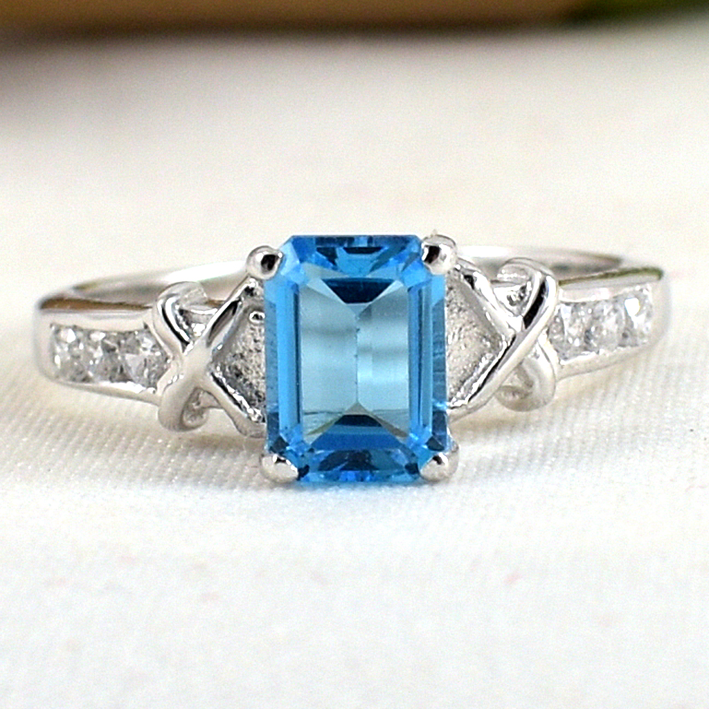 SKJewelryfactory แหวนเหลี่ยมพลอยสวิสบลูโทปาซแท้ ดีไซน์เรียบๆดูทันสมัย ER00792-SBT
