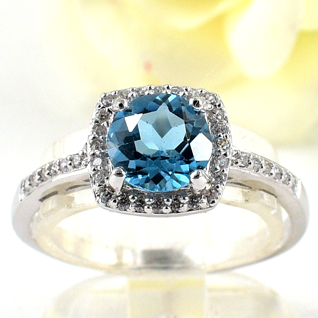 SKJewelryfactory แหวนสวิสบลูโทปาซแท้ ดีไซน์ล้อมเพชร เรียบหรู เล่นไฟดี ER02153-SBT