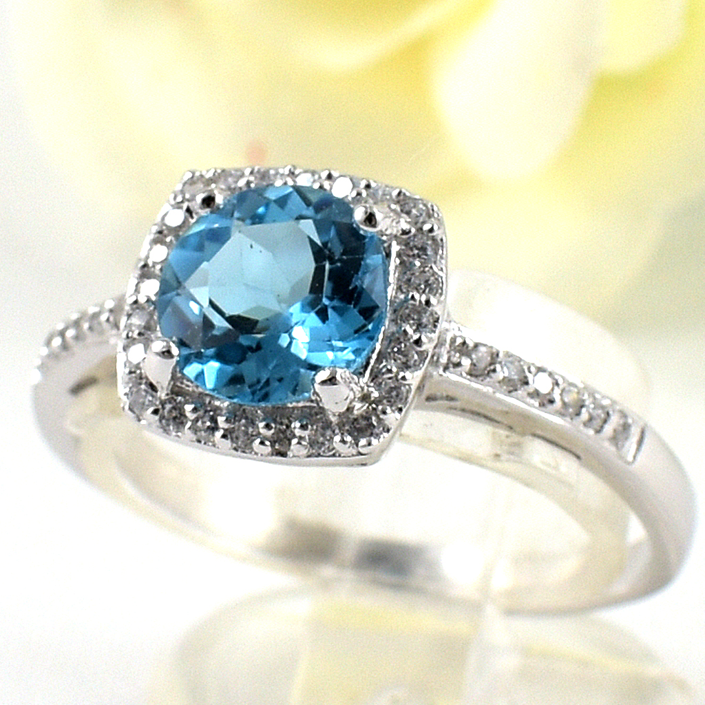 SKJewelryfactory แหวนสวิสบลูโทปาซแท้ ดีไซน์ล้อมเพชร เรียบหรู เล่นไฟดี ER02153-SBT