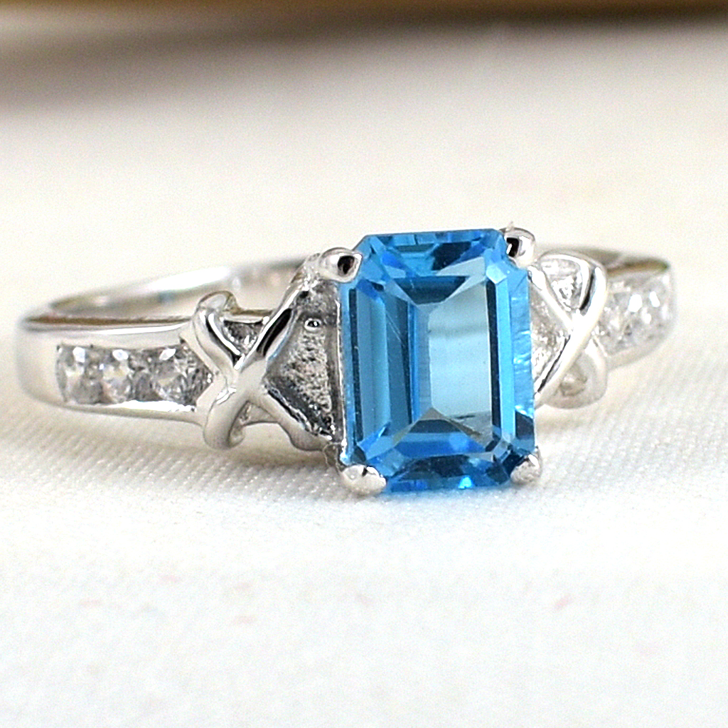SKJewelryfactory แหวนเหลี่ยมพลอยสวิสบลูโทปาซแท้ ดีไซน์เรียบๆดูทันสมัย ER00792-SBT