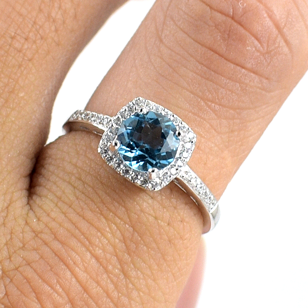 SKJewelryfactory แหวนสวิสบลูโทปาซแท้ ดีไซน์ล้อมเพชร เรียบหรู เล่นไฟดี ER02153-SBT