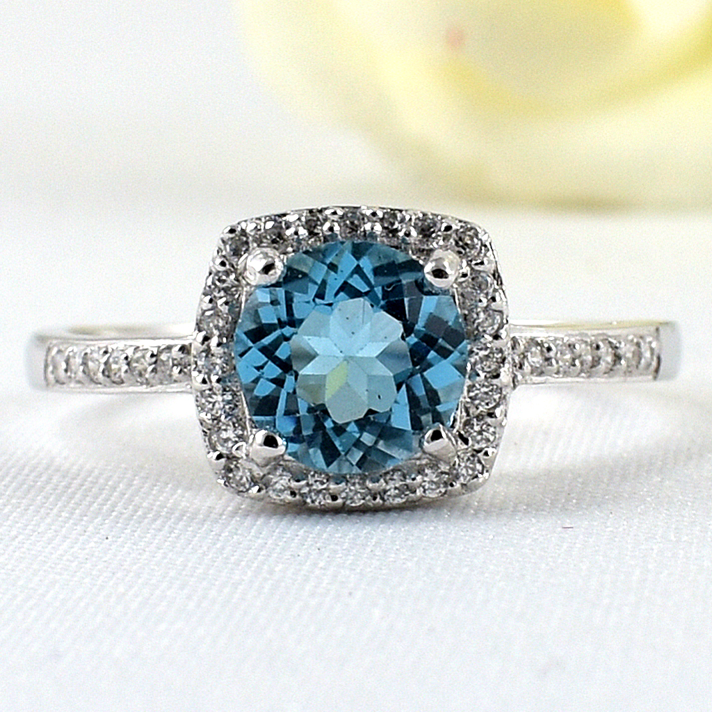SKJewelryfactory แหวนสวิสบลูโทปาซแท้ ดีไซน์ล้อมเพชร เรียบหรู เล่นไฟดี ER02153-SBT