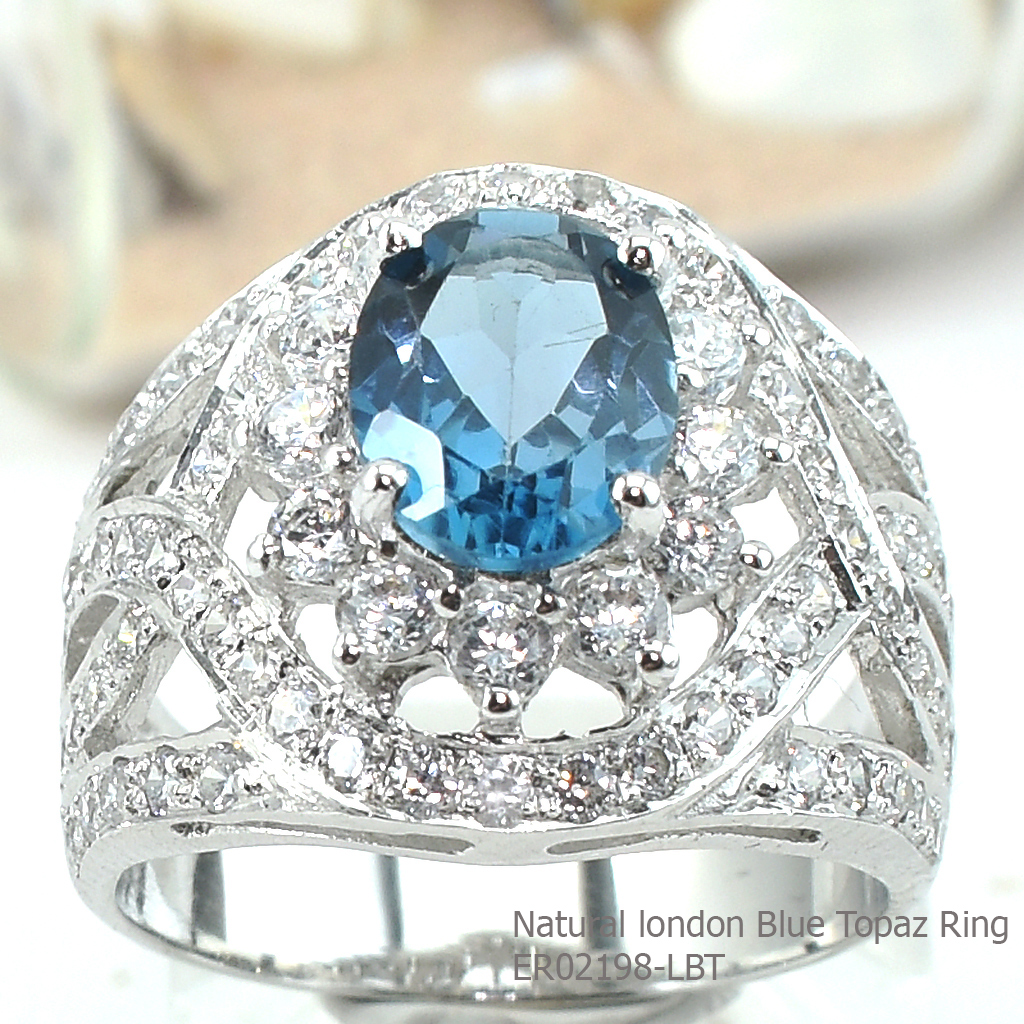 SKJewelryfactory แหวนเงินแท้ ฝังพลอยลอนดอนบลูโทปาซแท้ ล้อมเพชร ดีไซด์หรูหราอลังการณ์ ER02198-LBT