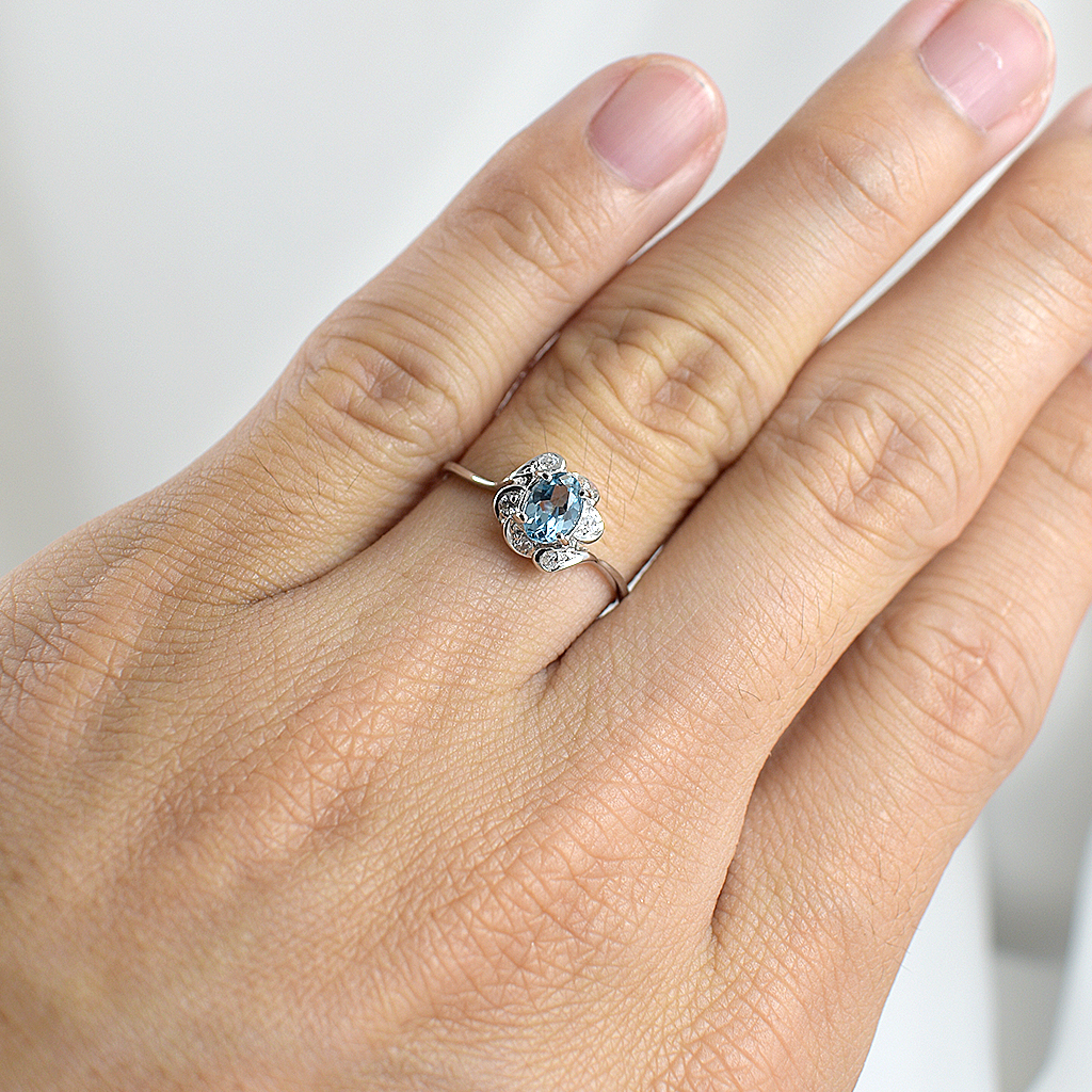 SKJewelryfactory แหวนเงินแท้ 92.5% ฝังพลอยสวิสบลูโทปาซแท้ ประดับเพชร ER01112-SBT