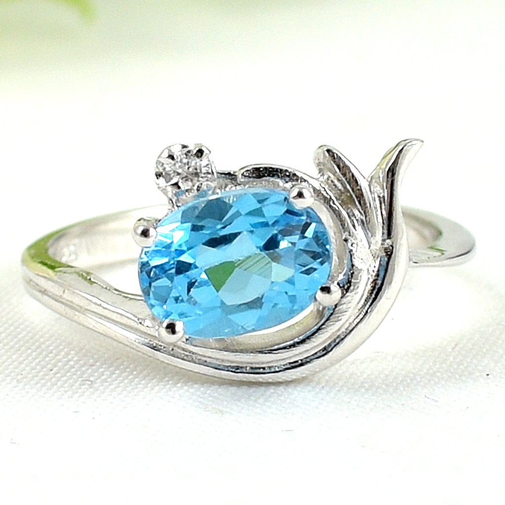 SKJewelryfactory แหวนเงินแท้ 92.5% ฝังพลอยสวิสบลูโทปาซแท้ ดีไซด์สวยเก๋ ไม่เหมือนใคร ER01446-SBT
