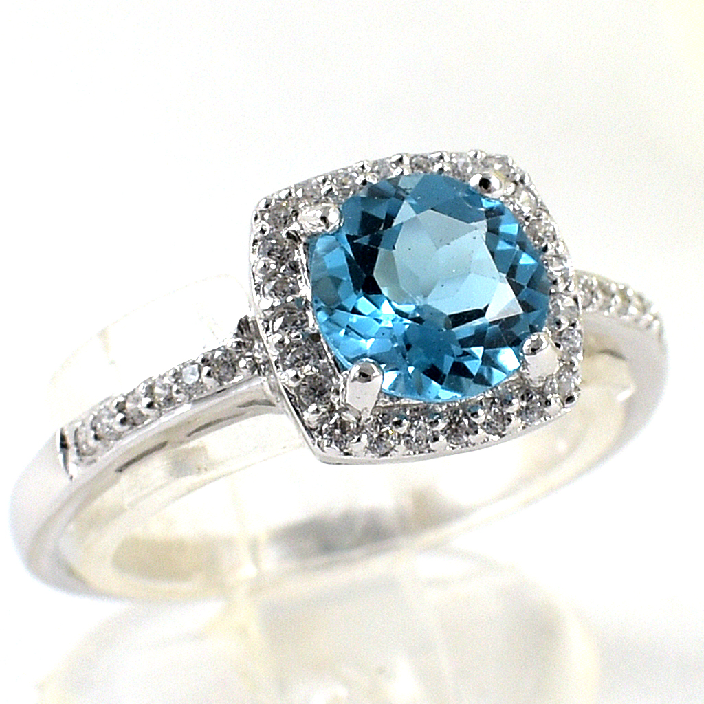 SKJewelryfactory แหวนสวิสบลูโทปาซแท้ ดีไซน์ล้อมเพชร เรียบหรู เล่นไฟดี ER02153-SBT