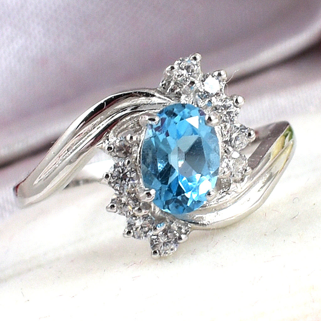 SKJewelryFactory แหวนเงินแท้พลอยสวิสบลูโทปาซแท้ แหวนพลอยแท้ล้อมเพชร ER01219-SBT