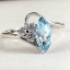 SKJewelryfactory แหวนมาร์คี พลอยรูปเม็ดข้าวสาร พลอยบลูโทปาซแท้ ER02350-BTP